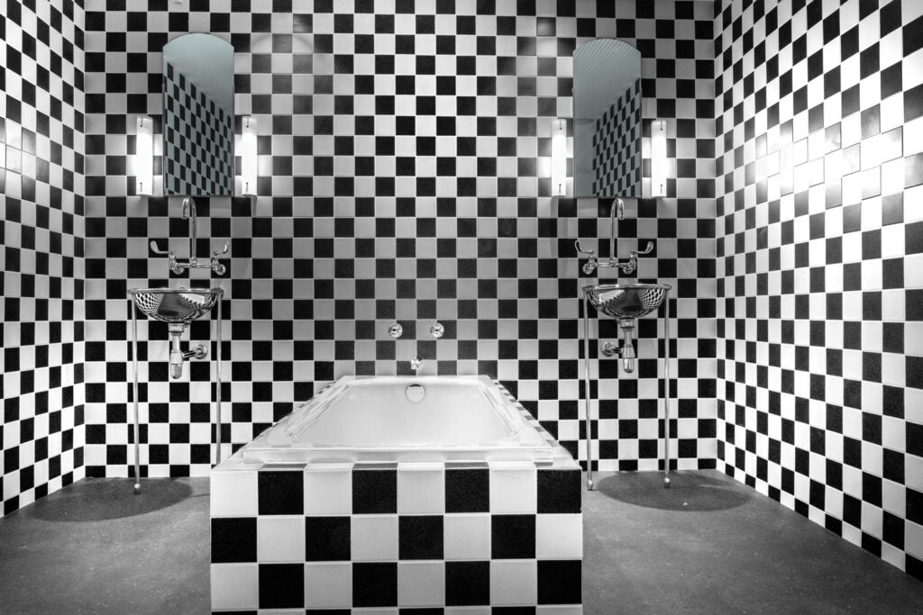 the recon­struc­tion of a bathroom at New York’s Morgans Hotel, which Andrée Putman designed in 1984