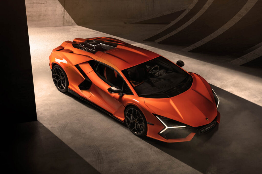 Lamborghini Revuelto in deep orange in an artful garage