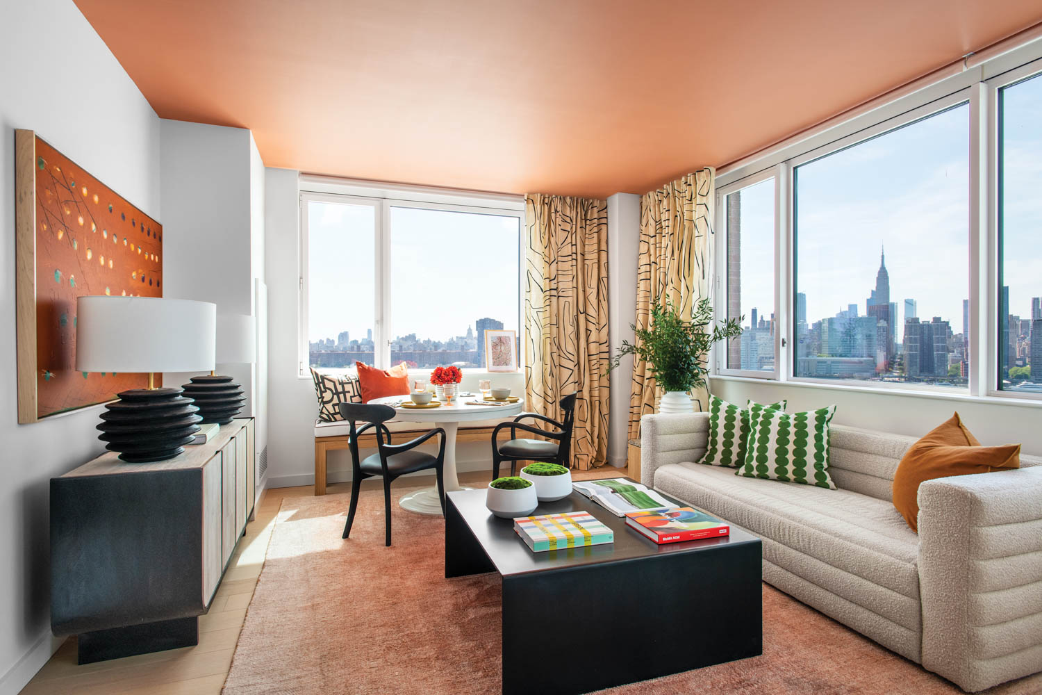 A living area with expansive windows in Gotham Point