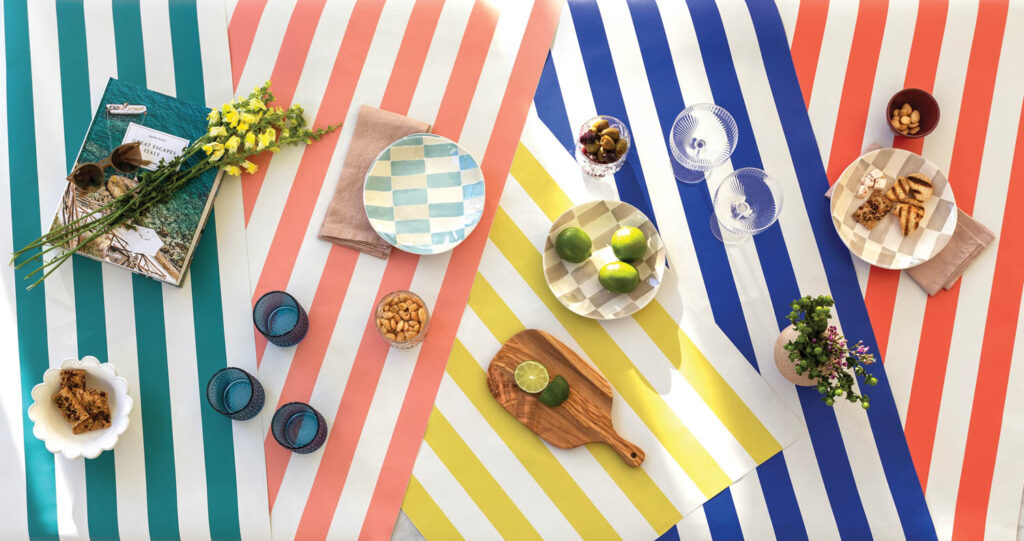 various picnic-like stripes on the bright and sunny Chasing Paper x Hyphen Co. wallpaper collection