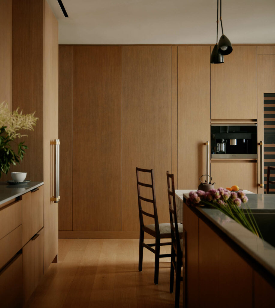 a modern kitchen with wood paneling throughout
