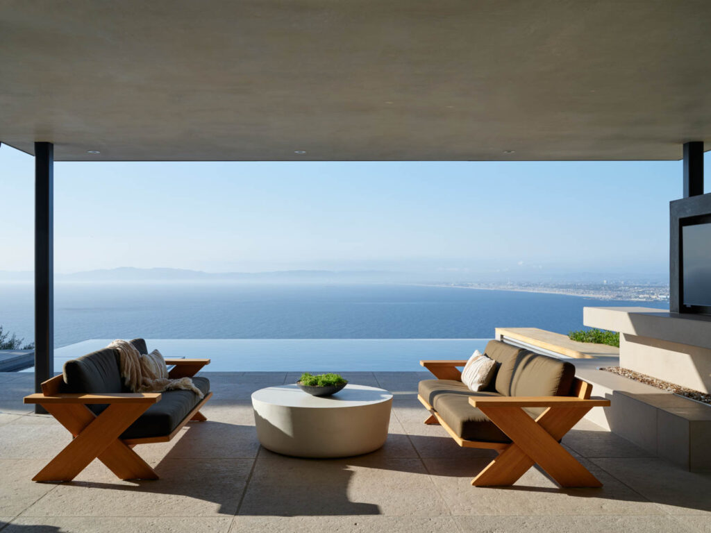 an infinity edge pool with a view toward Malibu