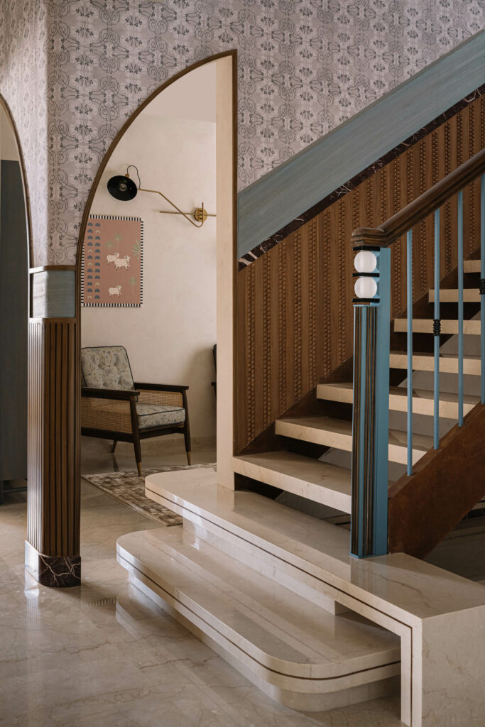 the stairwell of a modern apartment with classical-inspired decor