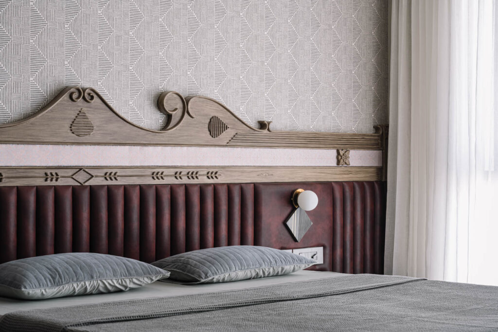 a wooden headboard with carved details
