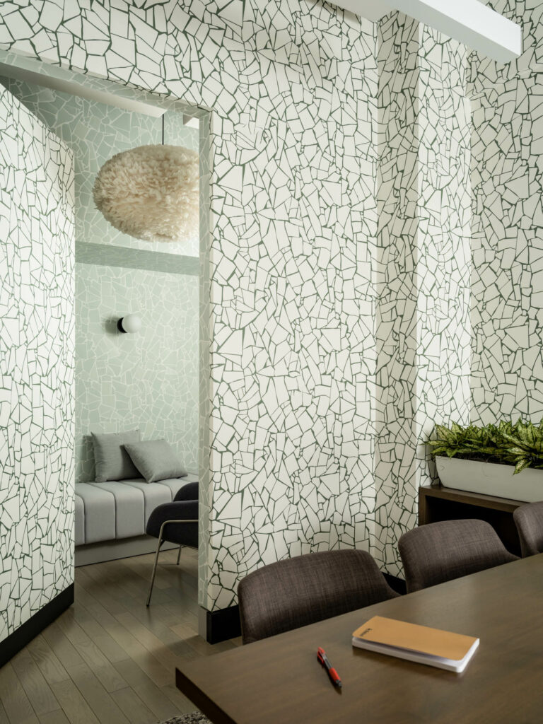 a crackled green and white wallpaper in Retool New York