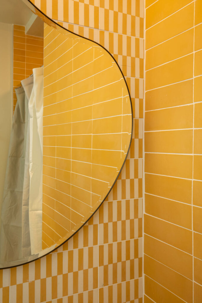 a vibrant yellow office bathroom
