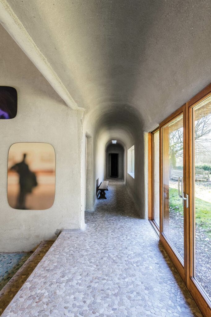 flooring made from flattened pebbles in the hallway of a Belgian home