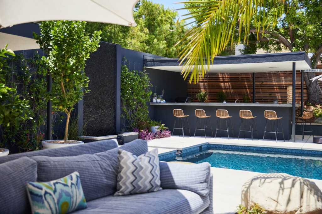 an outdoor lounger next to a pool at a SoCal home