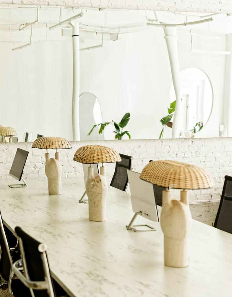 Table lamps with mushroom-like shades in the Sakara Life office